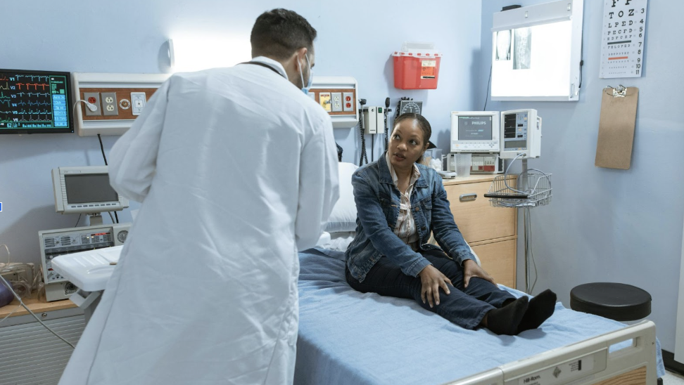 Patient consulting with doctor after an accident-related injury